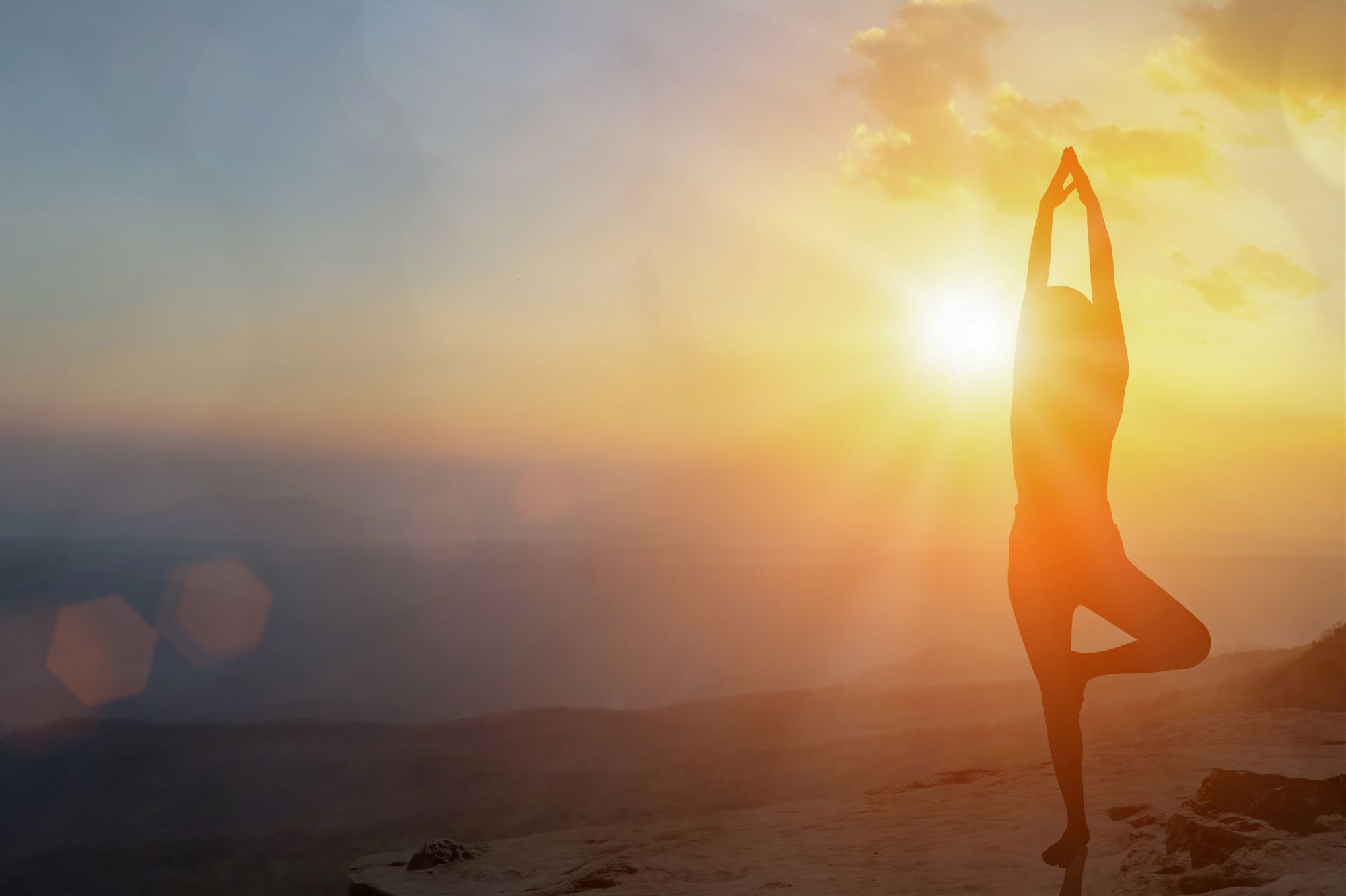 A hiker doing yoga.